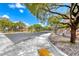 Quiet neighborhood street surrounded by lush greenery and well-maintained sidewalks at 1033 Logan Patrick Dr, Henderson, NV 89052