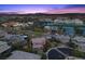 View of the home with mature landscaping and surrounding neighborhood amenities in a desert community at 10470 Dove Meadow Way, Las Vegas, NV 89135
