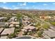 An aerial view of a neighborhood, highlighting the surrounding landscape at 10470 Dove Meadow Way, Las Vegas, NV 89135