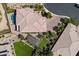 Aerial view showcasing property's layout: a backyard with pool, lush landscaping, a pergola, and manicured lawn at 10470 Dove Meadow Way, Las Vegas, NV 89135