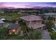 Beautiful aerial view of a luxury home, showcasing the tile roof, manicured yard, outdoor living, and the surrounding neighborhood at 10470 Dove Meadow Way, Las Vegas, NV 89135