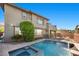 Beautiful backyard with a private pool, spa, and lush landscaping, creating a serene oasis at 10470 Dove Meadow Way, Las Vegas, NV 89135