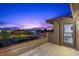Balcony features scenic views of the city skyline during twilight at 10470 Dove Meadow Way, Las Vegas, NV 89135