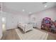 Bright bedroom featuring a bed, dresser, a window and plenty of room for activities at 10470 Dove Meadow Way, Las Vegas, NV 89135