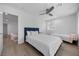 Spacious bedroom with ceiling fan, natural light, and two queen size beds at 10470 Dove Meadow Way, Las Vegas, NV 89135