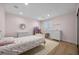 Cozy bedroom featuring a bed, dresser, and a window letting in natural light at 10470 Dove Meadow Way, Las Vegas, NV 89135