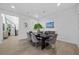 Well-lit dining area with modern furniture, stylish decor, and plenty of seating at 10470 Dove Meadow Way, Las Vegas, NV 89135