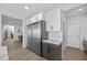 Bright kitchen boasts stainless steel appliances, white cabinets, and quartz countertops at 10470 Dove Meadow Way, Las Vegas, NV 89135