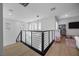Upstairs landing with a stylish chandelier and playroom area at 10470 Dove Meadow Way, Las Vegas, NV 89135