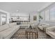 Spacious living room boasts modern decor and a seamless flow to the gourmet kitchen at 10470 Dove Meadow Way, Las Vegas, NV 89135