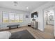 Bright main bedroom with modern ceiling fan, recessed lights, and large windows at 10470 Dove Meadow Way, Las Vegas, NV 89135