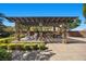 Outdoor kitchen featuring stone pillars, built-in grill, and ample counter space for entertaining at 10470 Dove Meadow Way, Las Vegas, NV 89135