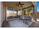 Comfortable covered patio with sleek furniture, perfect for outdoor relaxation and entertaining at 10470 Dove Meadow Way, Las Vegas, NV 89135