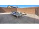Outdoor patio area with sun loungers and a privacy wall, perfect for relaxing and enjoying sunny days at 10470 Dove Meadow Way, Las Vegas, NV 89135