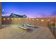 Relaxing patio with lounge chairs and string lights, perfect for outdoor enjoyment at 10470 Dove Meadow Way, Las Vegas, NV 89135