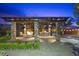 Outdoor pergola with a built in grilling station and fire pit at 10470 Dove Meadow Way, Las Vegas, NV 89135