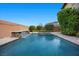 Private pool with a waterfall feature and lush landscaping, perfect for relaxing and entertaining at 10470 Dove Meadow Way, Las Vegas, NV 89135