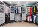 Organized walk-in closet with custom shelving, hanging rods, and plenty of storage space at 10470 Dove Meadow Way, Las Vegas, NV 89135