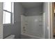 Bathroom featuring a shower and bathtub combo and a view of the toilet at 11416 Belmont Lake Dr # 102, Las Vegas, NV 89135