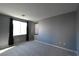 Calming bedroom features new carpet, large windows, and neutral walls at 11416 Belmont Lake Dr # 102, Las Vegas, NV 89135