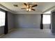 Primary bedroom with grey walls, carpeted floor, and ceiling fan with light fixture at 11416 Belmont Lake Dr # 102, Las Vegas, NV 89135