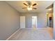 Upstairs bonus room with neutral carpet, ceiling fan, and a window at 11416 Belmont Lake Dr # 102, Las Vegas, NV 89135
