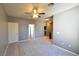 Upstairs bonus room with neutral carpet, ceiling fan, and a window at 11416 Belmont Lake Dr # 102, Las Vegas, NV 89135