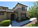 Inviting home featuring a well-maintained lawn, arched entryway and clearly displayed address number at 11416 Belmont Lake Dr # 102, Las Vegas, NV 89135