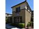 Two-story condo featuring a well-maintained lawn, arched entryway and clearly displayed address number at 11416 Belmont Lake Dr # 102, Las Vegas, NV 89135