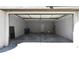 Spacious garage features an automatic door opener and a pedestrian door at 11416 Belmont Lake Dr # 102, Las Vegas, NV 89135