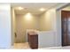 Well-lit hallway featuring a built-in cabinet and neutral decor, offering ample storage at 11416 Belmont Lake Dr # 102, Las Vegas, NV 89135