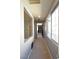 Hallway with carpeted floor, natural light, and grey colored walls that leads to other rooms at 11416 Belmont Lake Dr # 102, Las Vegas, NV 89135