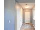 Bright hallway with tile floors, neutral paint, and direct access to other rooms at 11416 Belmont Lake Dr # 102, Las Vegas, NV 89135