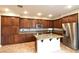 Well-equipped kitchen features a center island, stainless steel appliances, and granite countertops at 11416 Belmont Lake Dr # 102, Las Vegas, NV 89135