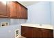 Functional laundry room with a sink, countertop, and overhead cabinet storage at 11416 Belmont Lake Dr # 102, Las Vegas, NV 89135