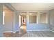 Open living area featuring vinyl plank floors, neutral paint, and view to the hallway and other rooms at 11416 Belmont Lake Dr # 102, Las Vegas, NV 89135
