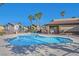Enjoy the community pool surrounded by palm trees and well-maintained landscaping at 1152 Paradise Desert Ave, Henderson, NV 89002