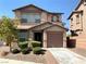 Charming two-story home with a well-maintained yard and inviting curb appeal in a residential neighborhood at 1152 Paradise Desert Ave, Henderson, NV 89002