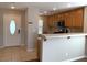 Bright kitchen featuring tile floors, breakfast bar, and modern appliances with great natural light at 1152 Paradise Desert Ave, Henderson, NV 89002
