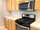 Modern kitchen with stainless steel appliances and gas stove for a seamless cooking experience at 1152 Paradise Desert Ave, Henderson, NV 89002
