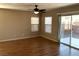 Bright living room with wood floors and a sliding door with great natural light at 1152 Paradise Desert Ave, Henderson, NV 89002