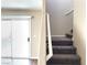 Interior view of staircase with gray carpet, leading to the upper level of the house at 1152 Paradise Desert Ave, Henderson, NV 89002