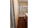 Full bathroom features a wood vanity, toilet, and tub with a sliding shower door at 11882 Snow Bank St, Las Vegas, NV 89183