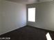 A bright bedroom features neutral walls, standard window, and wall-to-wall carpeting at 11882 Snow Bank St, Las Vegas, NV 89183