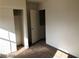 Bedroom with closet that has bi-fold doors, and neutral walls and carpet at 11882 Snow Bank St, Las Vegas, NV 89183