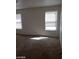 Carpeted bedroom has two windows allowing natural light in at 11882 Snow Bank St, Las Vegas, NV 89183