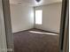 A well-lit bedroom features neutral walls, standard window, and wall-to-wall carpeting at 11882 Snow Bank St, Las Vegas, NV 89183