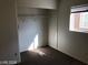 A walk-in closet with a small window, wire shelving and wall-to-wall carpet at 11882 Snow Bank St, Las Vegas, NV 89183