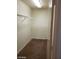 Walk-in closet with carpet, white shelves and hanger bars at 11882 Snow Bank St, Las Vegas, NV 89183