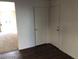 Hallway in home has two doors and carpeted living room can be seen at 11882 Snow Bank St, Las Vegas, NV 89183